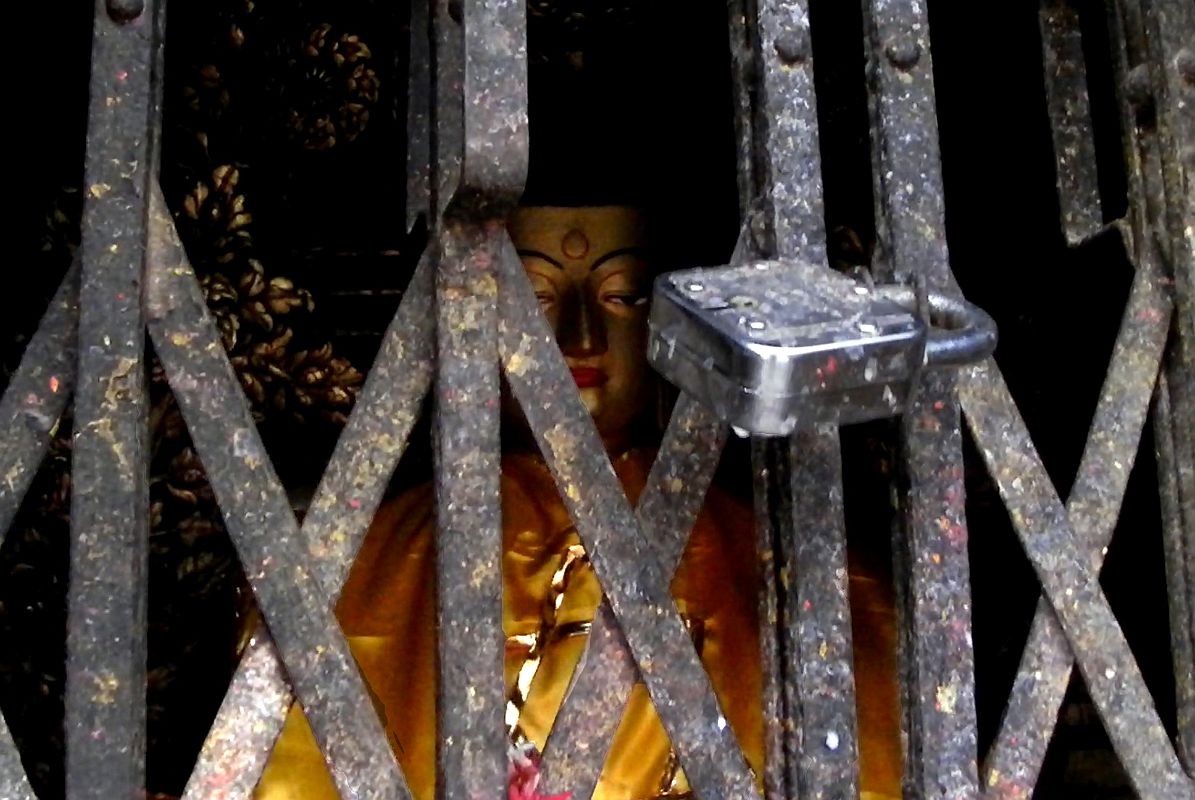 Kathmandu Swayambhunath 23 Ratnasambhava South Dhyani Buddha Statue Behind Mesh 